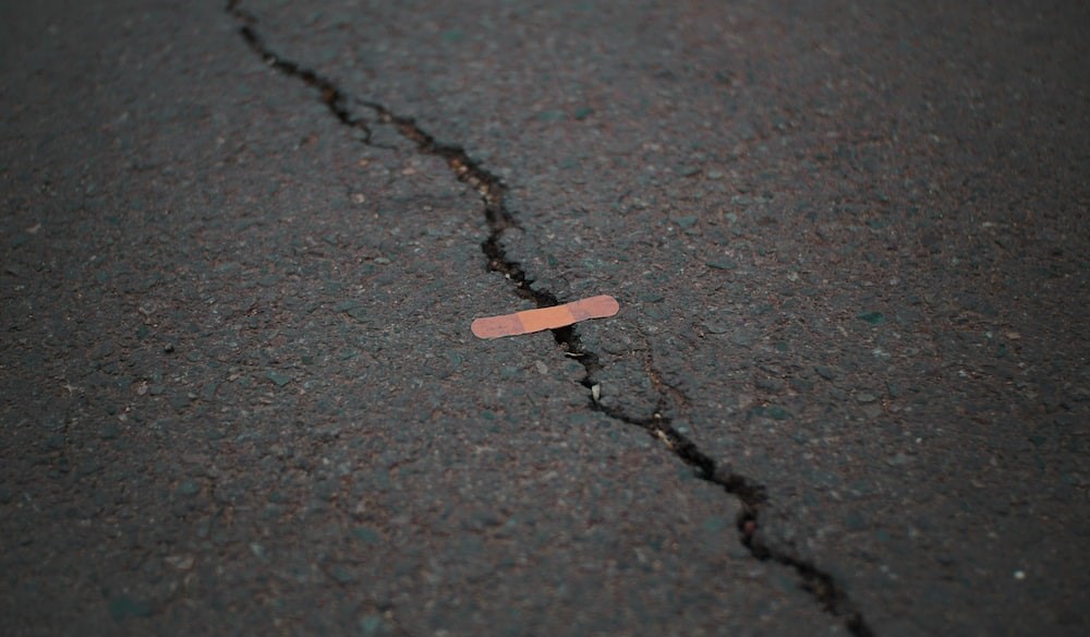 Attempt at fixing a road crack with a bandaid